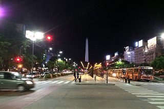 07 Buses Travel Along Avenida 9 de Julio Avenue At Night With The Obelisk Obelisco Beyond Buenos Aires.jpg